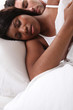 mixed couple sleeping