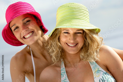 Photo: Two female friends having fun at the beach Two female friends having fun at the beach