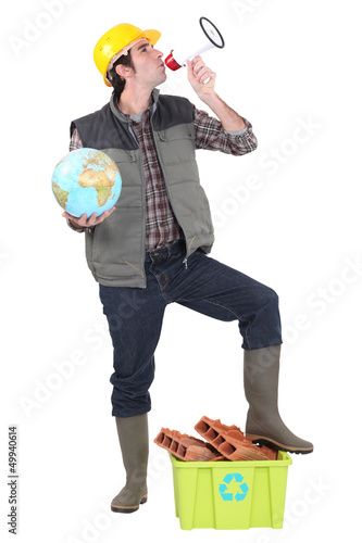 Photo: Man stood with megaphone and globe Man stood with megaphone and globe