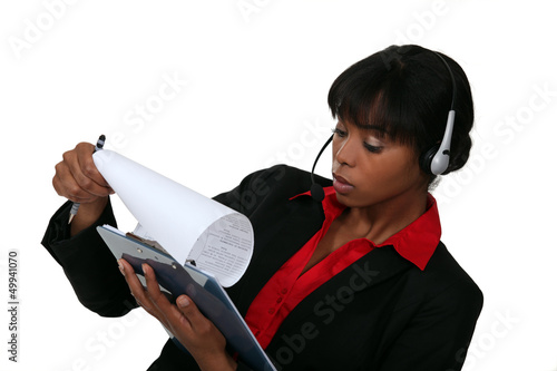 Photo: Call-center worker with clip-board Call-center worker with clip-board
