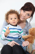 Woman, child and teddy bear
