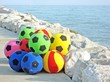 Photo: rubber balls for sale on the Italian beach in summer rubber balls for sale on the Italian beach in summer