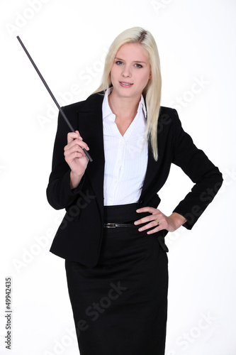 Photo: Blond instructor holding stick Blond instructor holding stick