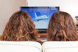 Photo: Two friends watching TV Two friends watching TV
