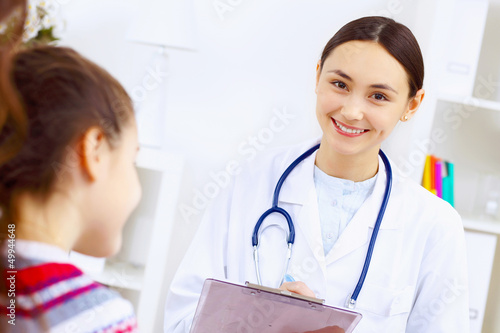 Photo: Little girl and a doctor Little girl and a doctor
