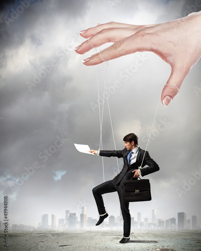 Photo: Business man marionette Business man marionette