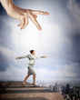 Business woman marionette
