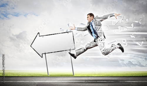 Photo: Businessman running on the road Businessman running on the road