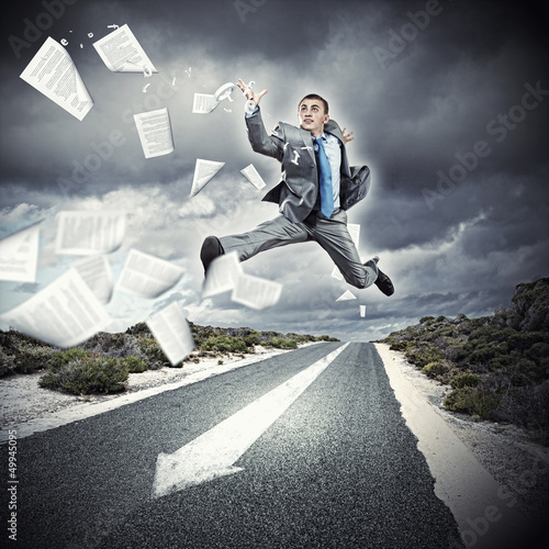 Photo: Businessman running on the road Businessman running on the road