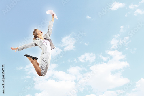 Photo: Image of jumping businesswoman Image of jumping businesswoman