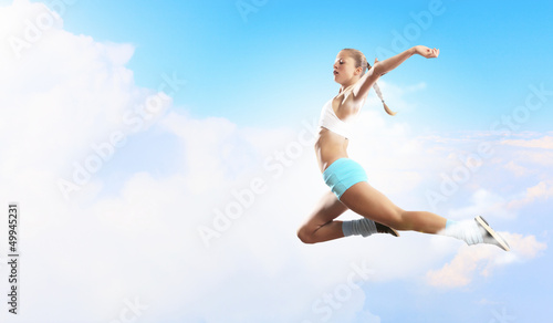 Photo: Image of sport woman jumping Image of sport woman jumping