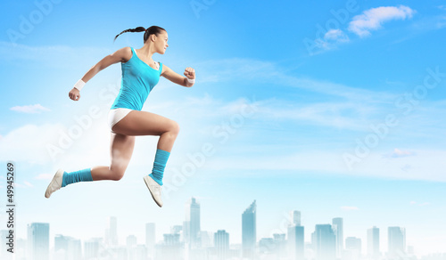 Photo: Image of sport woman jumping Image of sport woman jumping
