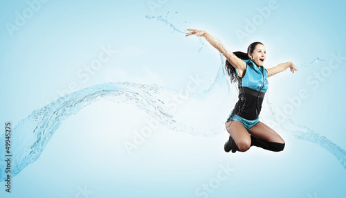 Photo: Young woman dancer. With lights effect. Young woman dancer. With lights effect.