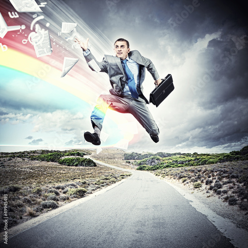 Photo: Businessman running on the road Businessman running on the road