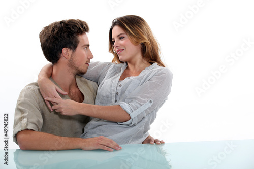 Photo: Woman sitting in the lap of her boyfriend Woman sitting in the lap of her boyfriend