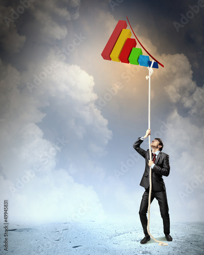 Photo: Image of businessman climbing rope Image of businessman climbing rope