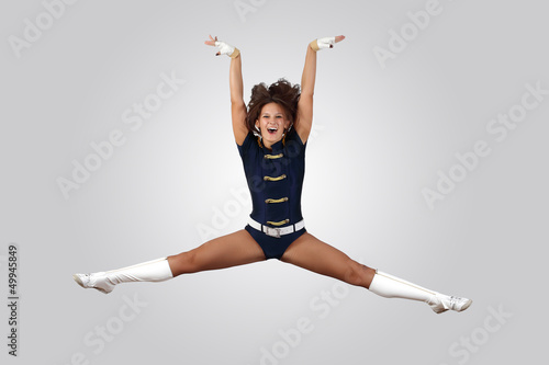 Photo: Young female dancer against white background Young female dancer against white background