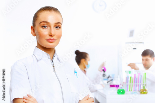 Photo: Team of scientists working in laboratory Team of scientists working in laboratory