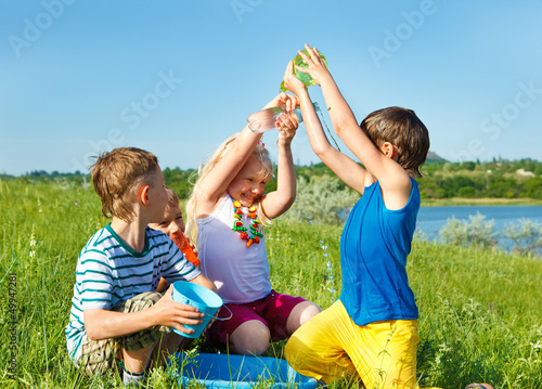 Photo: Excited friends pouring water Excited friends pouring water