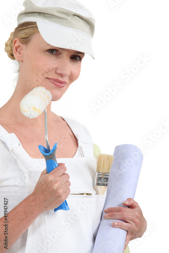 Photo: A woman holding painting A woman holding painting