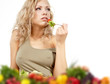 The young beautiful woman with the fresh vegetables
