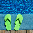 Sandals by a swimming pool