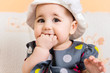 Foto: Beautiful baby girl in hat and dress Beautiful baby girl in hat and dress