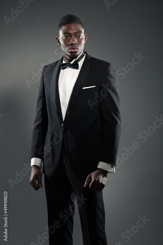 Photo: Cool stylish black american man in gala suit. Fashion shot. Cool stylish black american man in gala suit. Fashion shot.