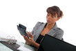 Businesswoman with a calculator