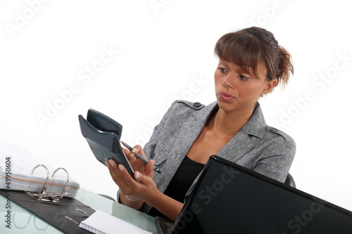 Photo: Businesswoman with a calculator Businesswoman with a calculator