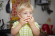 Surprised boy in the kitchen