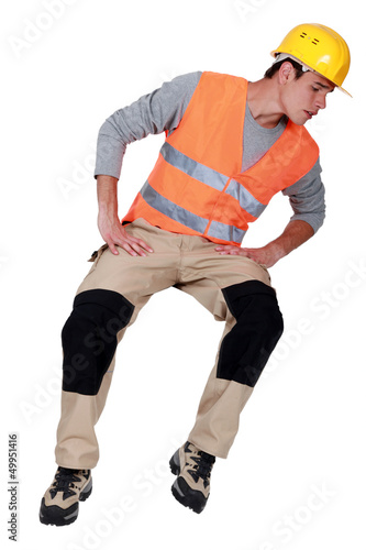 Photo: Construction worker looking down Construction worker looking down