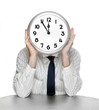 An businessman with a clock face. Time is money concept.