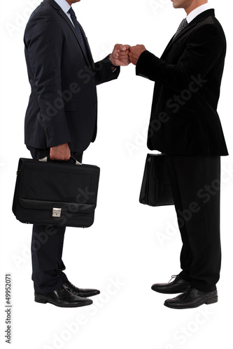 Photo: Two businessmen bumping fists Two businessmen bumping fists