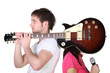 Boy with guitar over shoulder