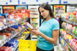 Woman checking food labelling