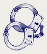 Metallic handcuffs. Doodle style