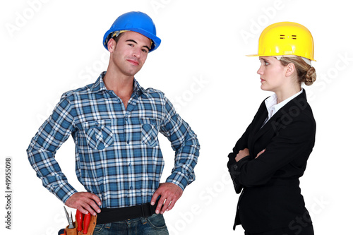 Photo: businesswoman and craftsman posing together businesswoman and craftsman posing together