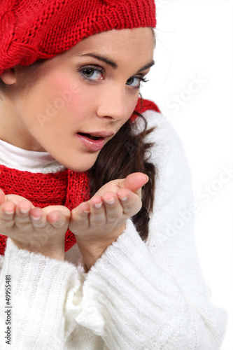 Photo: woman blowing kisses in air woman blowing kisses in air