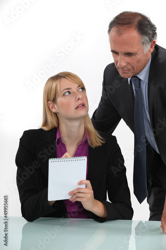 Photo: Woman silently communicating with her boss Woman silently communicating with her boss