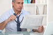 businessman reading the newspaper
