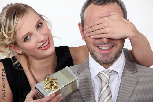 Photo: Couple with a surprise gift Couple with a surprise gift