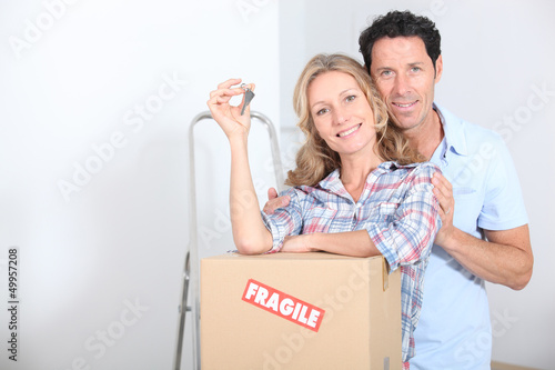 Photo: Couple with the keys of new flat Couple with the keys of new flat