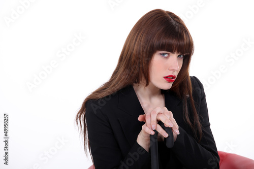 Photo: Seductive woman sat with umbrella Seductive woman sat with umbrella