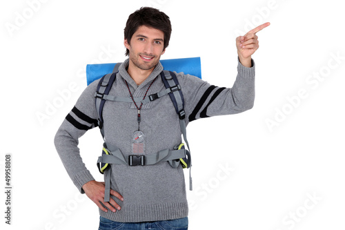Photo: portrait of a young man with camping gear portrait of a young man with camping gear