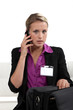 Businesswoman with a briefcase and phone
