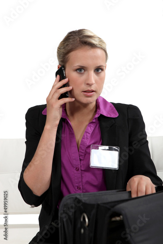 Photo: Businesswoman with a briefcase and phone Businesswoman with a briefcase and phone