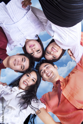 Photo: Business team in huddle outdoor Business team in huddle outdoor