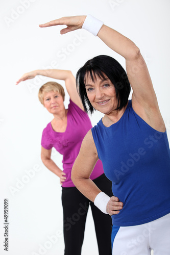 Photo: two senior women doing fitness two senior women doing fitness