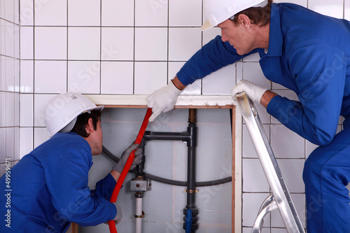 Photo: portrait of two plumbers portrait of two plumbers